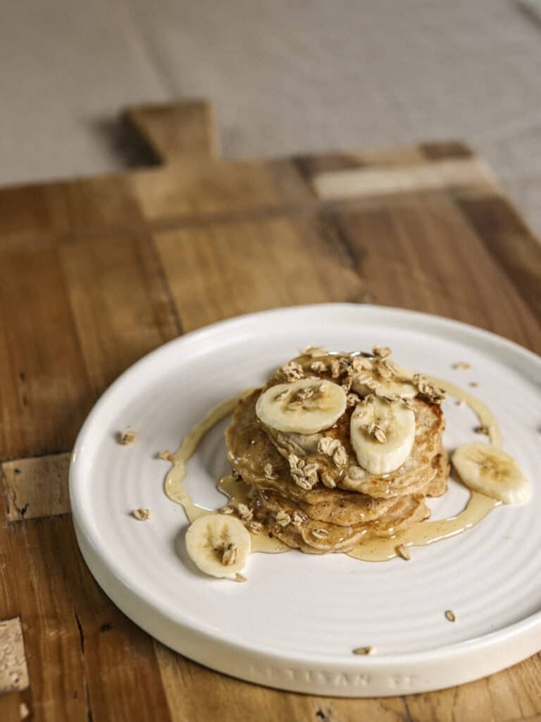 stack of pancakes with bananas and oats